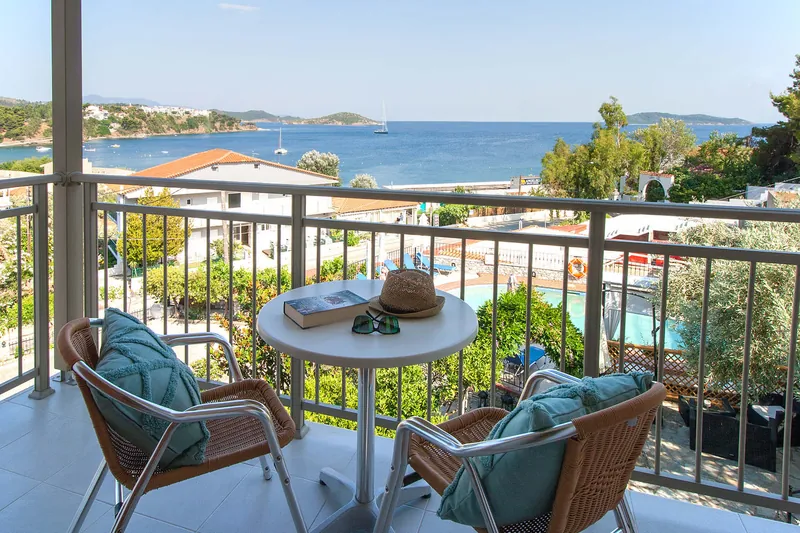 A studio balcony looking over the sea